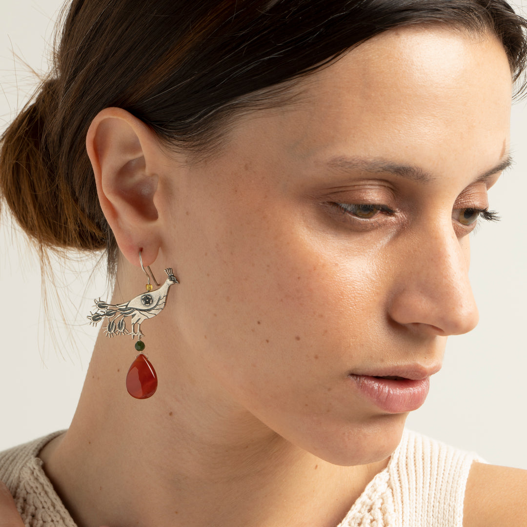 Aretes pavo real gde. llanura